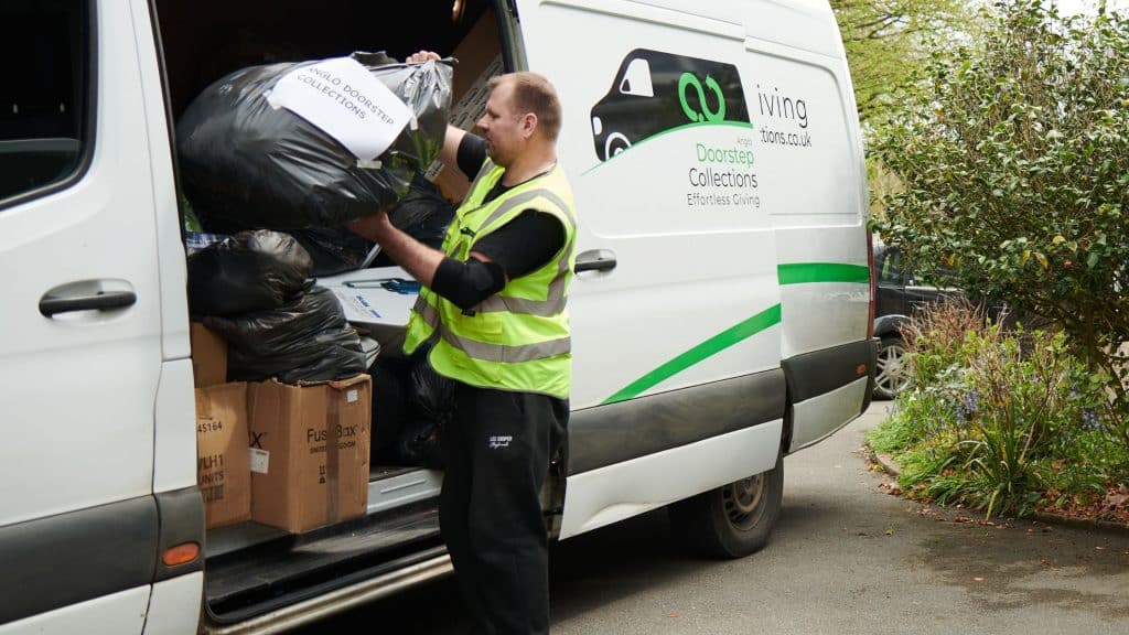 Charity Collections in Woking, driver loading  a van with donations.