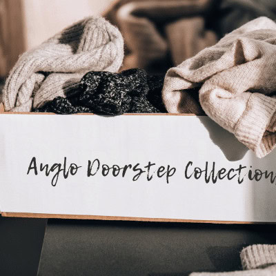 Box labelled anglo doorstep collections filled with clothes ready to be donated
