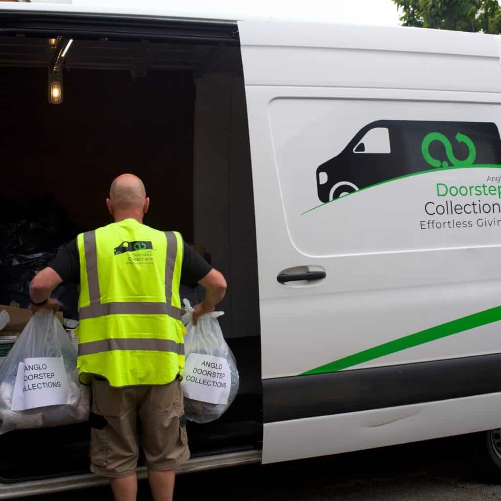 Anglo doorstep collections driver loading donations from a customers home into the van.