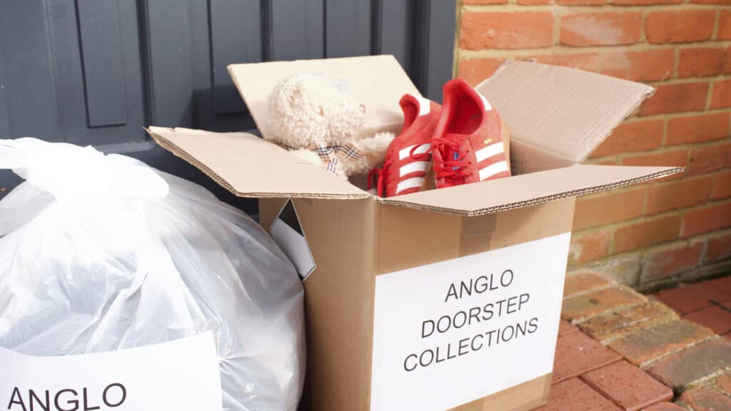 Box and bag of donations on the doorstep labelled Anglo doorstep collections